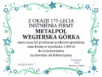 Prezent od Prezesa Zarządu oświęcimskiej Fabryki Maszyn i Urządzeń "OMAG" Sp. z o.o. Tadeusza Dziędziela - czek na 3 000 zł do wykorzystania na dowolny cel dobroczynny.